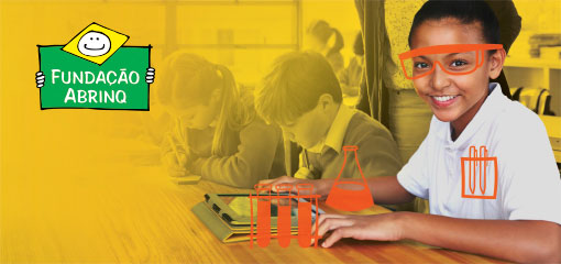 A young girl sitting at a desk with her classmates with whimsical illustrations of chemistry goggles, beakers and flasks. This image has a Fundacáo Abrinq logo.